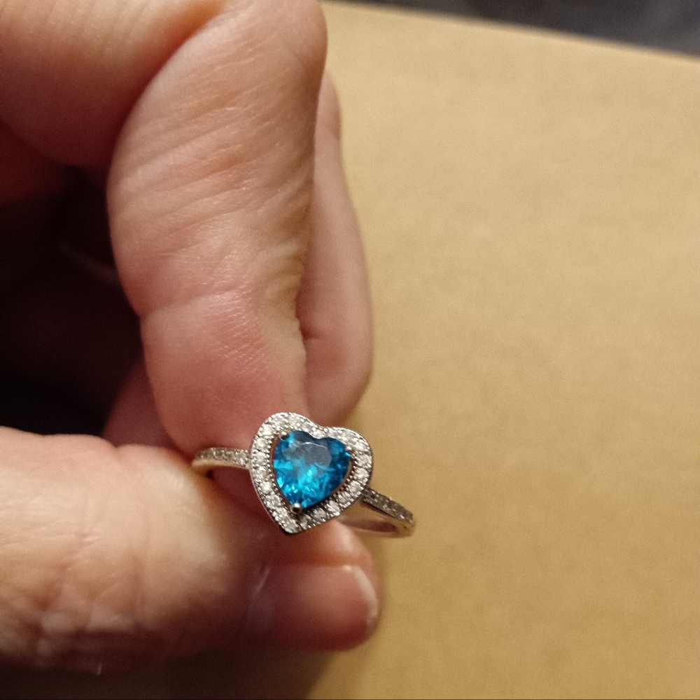 Women's size 9, silver diamond ring with blue zircon stone